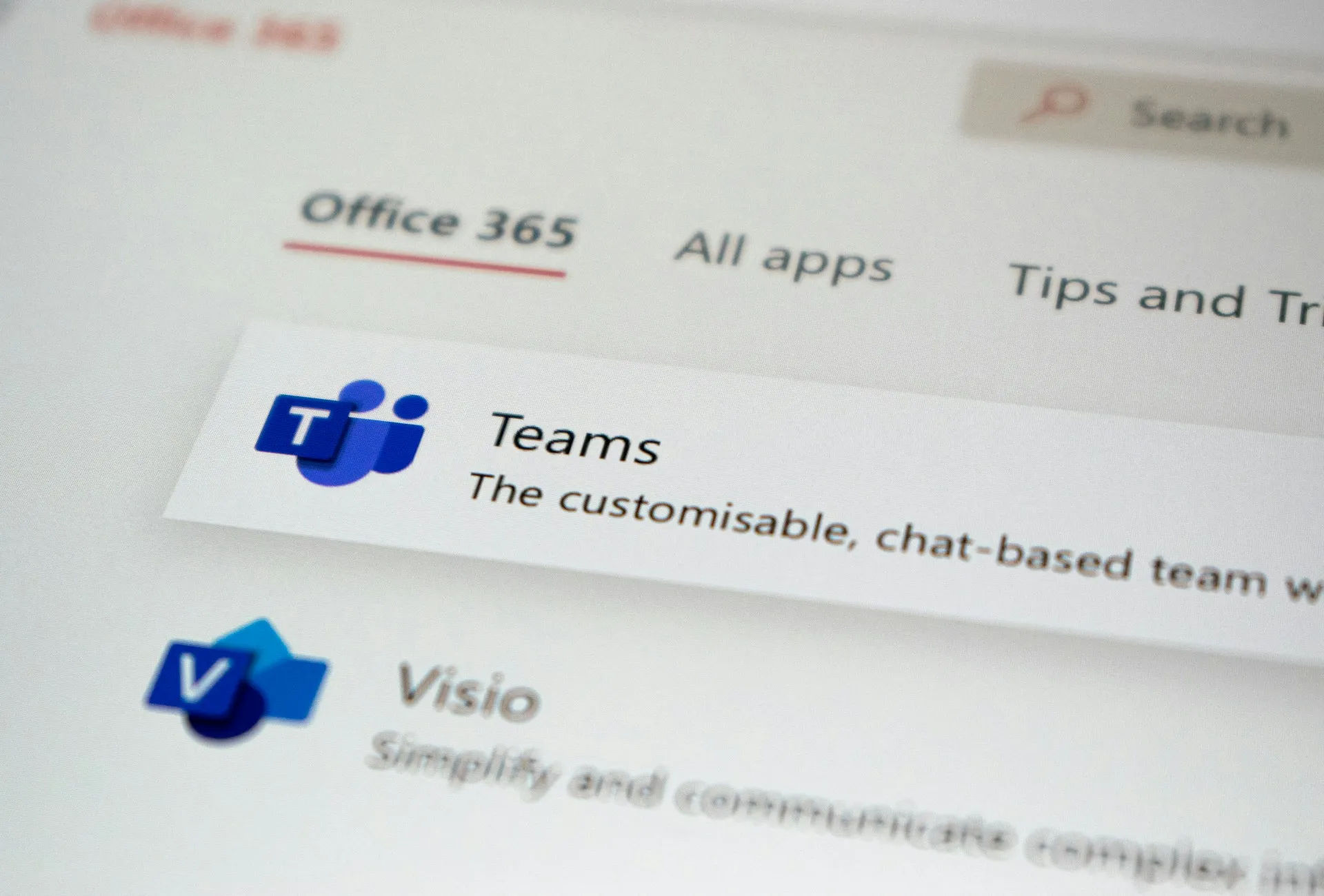 Team collaborating around a laptop